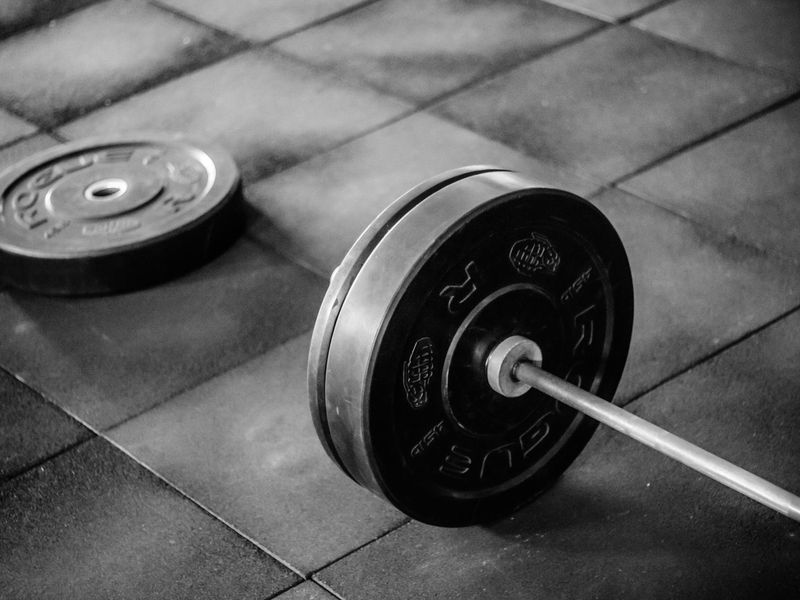 Fitness equipment arranged on a clean wooden floor