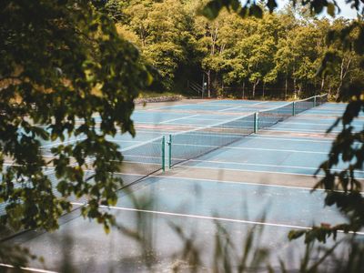 Outdoor fitness area surrounded by green trees